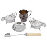 A pair of George V silver sauce boats and ladles, a christening mug and a dish