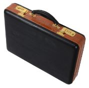 A Tanner Krolle black and tan stitched leather attaché briefcase