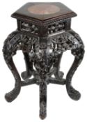 A late 19th c Chinese carved hardwood low stand or occasional table