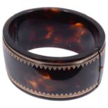 An attractive Victorian polished tortoiseshell pique bangle