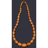 A graduated single row butterscotch amber bead necklace