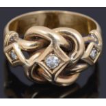 A diamond set love knot design gold ring