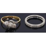 A three stone diamond set ring and a diamond set eternity ring
