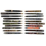 Collection of mottled and plain fountain pens / propelling pencils