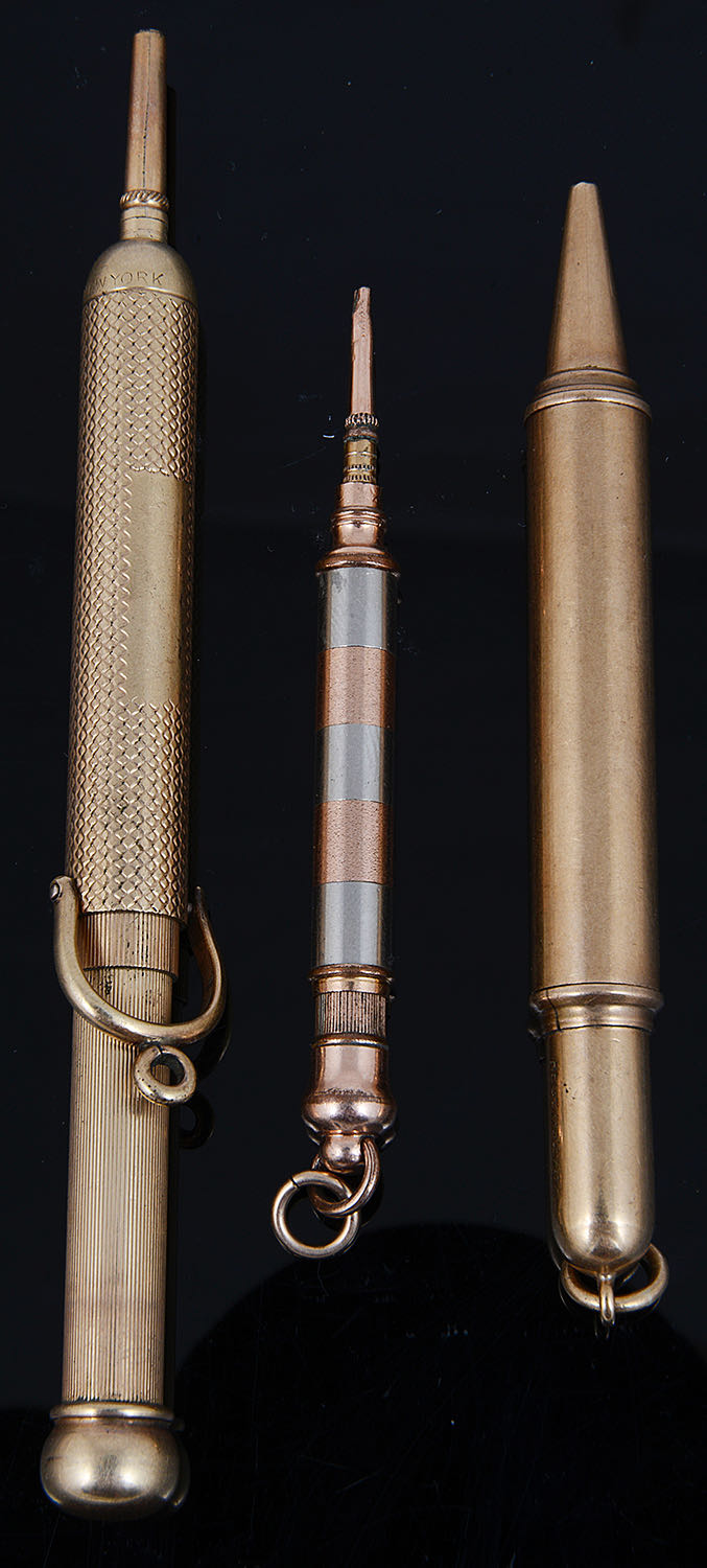 A 9ct gold Asprey propelling pencil and two other gilt metal propelling pencils
