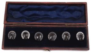 An unusual set of Vict. Whitby jet and silver horseshoe dress studs