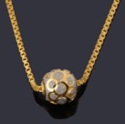 A gold single row necklace with bead pendant