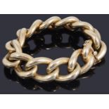 A gold oversized hollow curb link bracelet