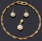 A pair of gold cultured pearl earrings and matching pendant on a gold chain