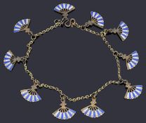 A delicate silver gilt trace link charm bracelet