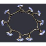 A delicate silver gilt trace link charm bracelet