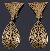 A pair of gold pierced drop earrings