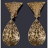 A pair of gold pierced drop earrings