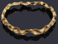 A 9ct gold abstract scalloped edge bracelet