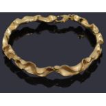 A 9ct gold abstract scalloped edge bracelet