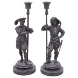 A pair of late 19th century patinated spelter figural candlesticks