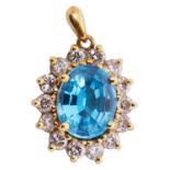 A delicate gold blue topaz and diamond pendant