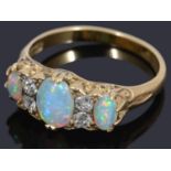 A Victorian three stone opal and diamond ring