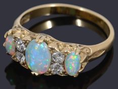 A Victorian three stone opal and diamond ring
