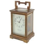 A late 19th c. French gilt brass carriage timepiece retailed by J.W. Benson
