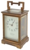 A late 19th c. French gilt brass carriage timepiece retailed by J.W. Benson