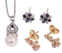 A white gold cultured pearl and diamond pendant and two pairs of earrings