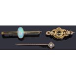 A gold single stone opal cabochon bar brooch and two other brooches