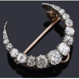 A late Victorian diamond set crescent brooch