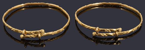 A pair of high carat Chinese tension set bangles