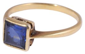 A delicate single stone square shaped step cut sapphire,