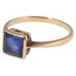 A delicate single stone square shaped step cut sapphire,