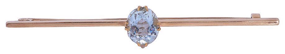 A gold single stone aquamarine bar brooch