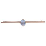 A gold single stone aquamarine bar brooch