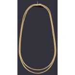 A gold two row graduated omega link necklace