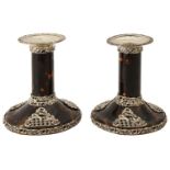 A pair of late Victorian silver mounted tortoiseshell dwarf candlesticks