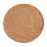 A gold Leopold II 20 Franc coin dated 1875