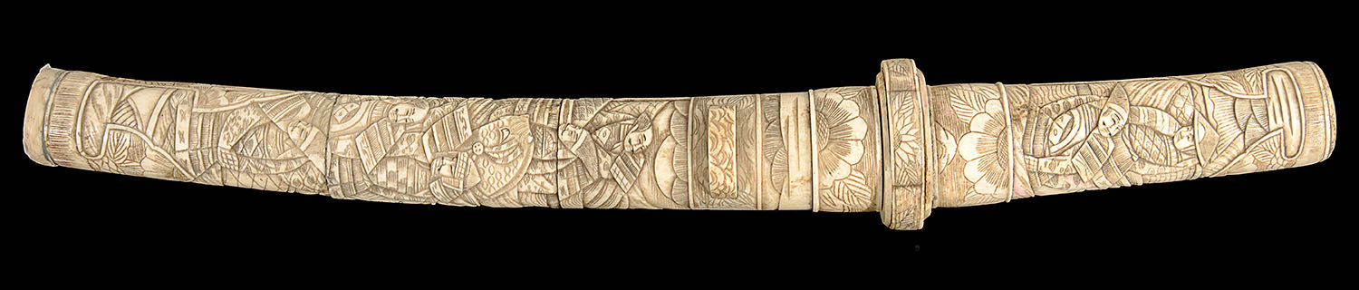 A late 19th/early 20th century Japanese carved bone tanto