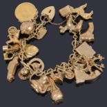 A gold fancy link charm bracelet with padlock