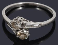 A two stone diamond crossover ring