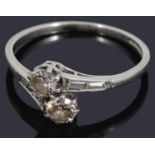 A two stone diamond crossover ring