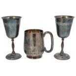 A late Victorian silver pint tankard and a pair of contemporary silver goblets
