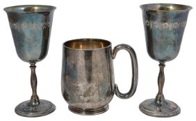 A late Victorian silver pint tankard and a pair of contemporary silver goblets