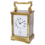 An early 20th century French gilt brass four pane carriage clock