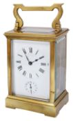 An early 20th century French gilt brass four pane carriage clock