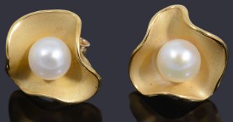 A pair of 9ct gold single cultured pearl floral earrings