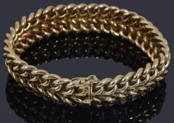 A gold two row curb link bracelet