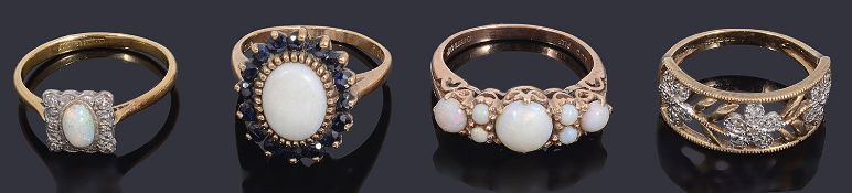 Three gold and opal set rings and a diamond set dress ring