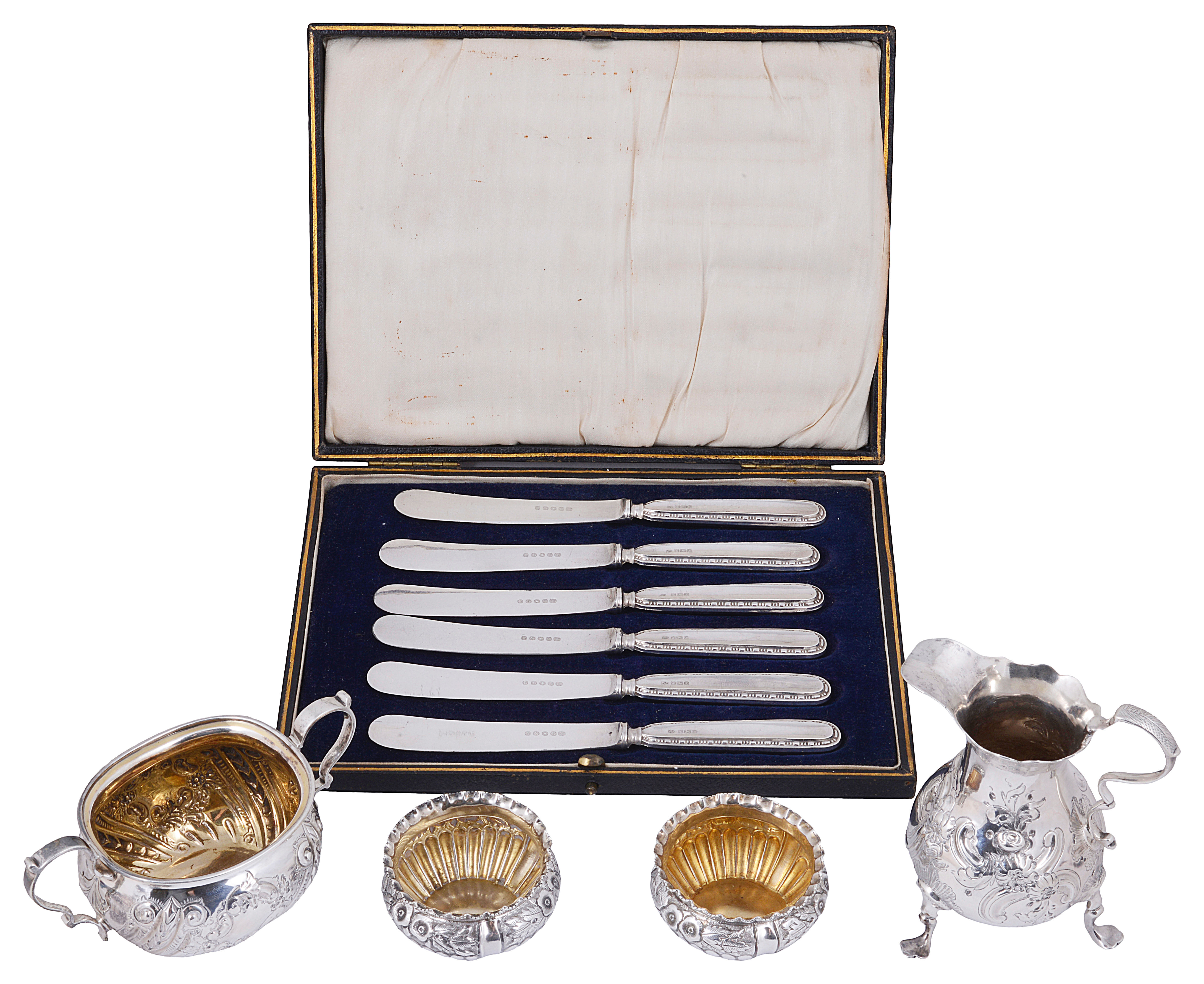 A George II silver cream jug and later silver items