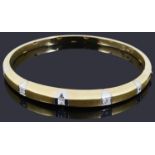 A two colour gold diamond hinged stiff bangle