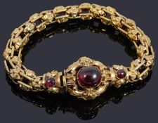 An attractive Victorian gold Etruscan revivial style garnet cabochon bracelet